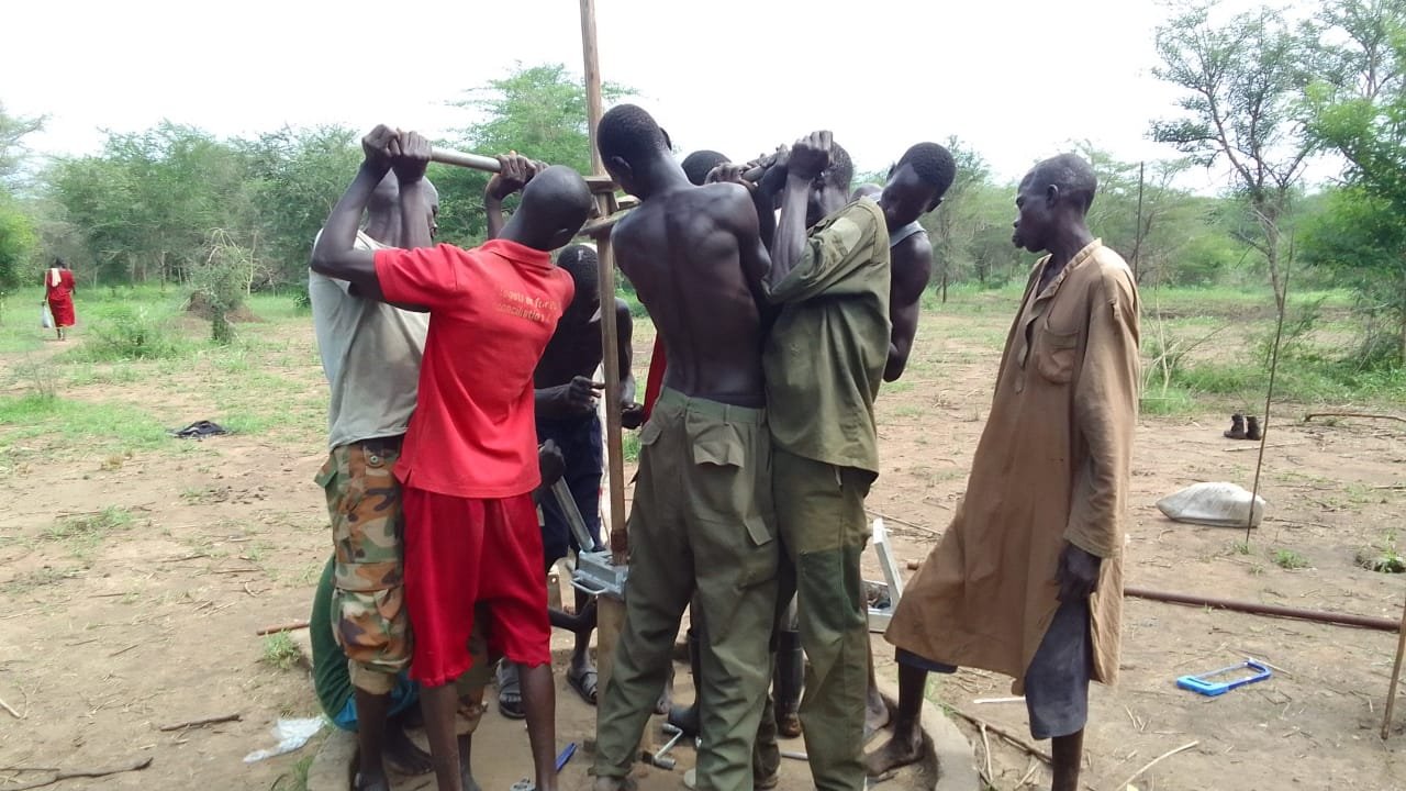 Community members collecting water from a clean water point